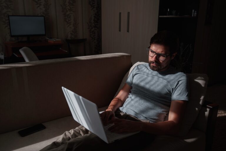 Man using laptop searching how to leave porn addiction.